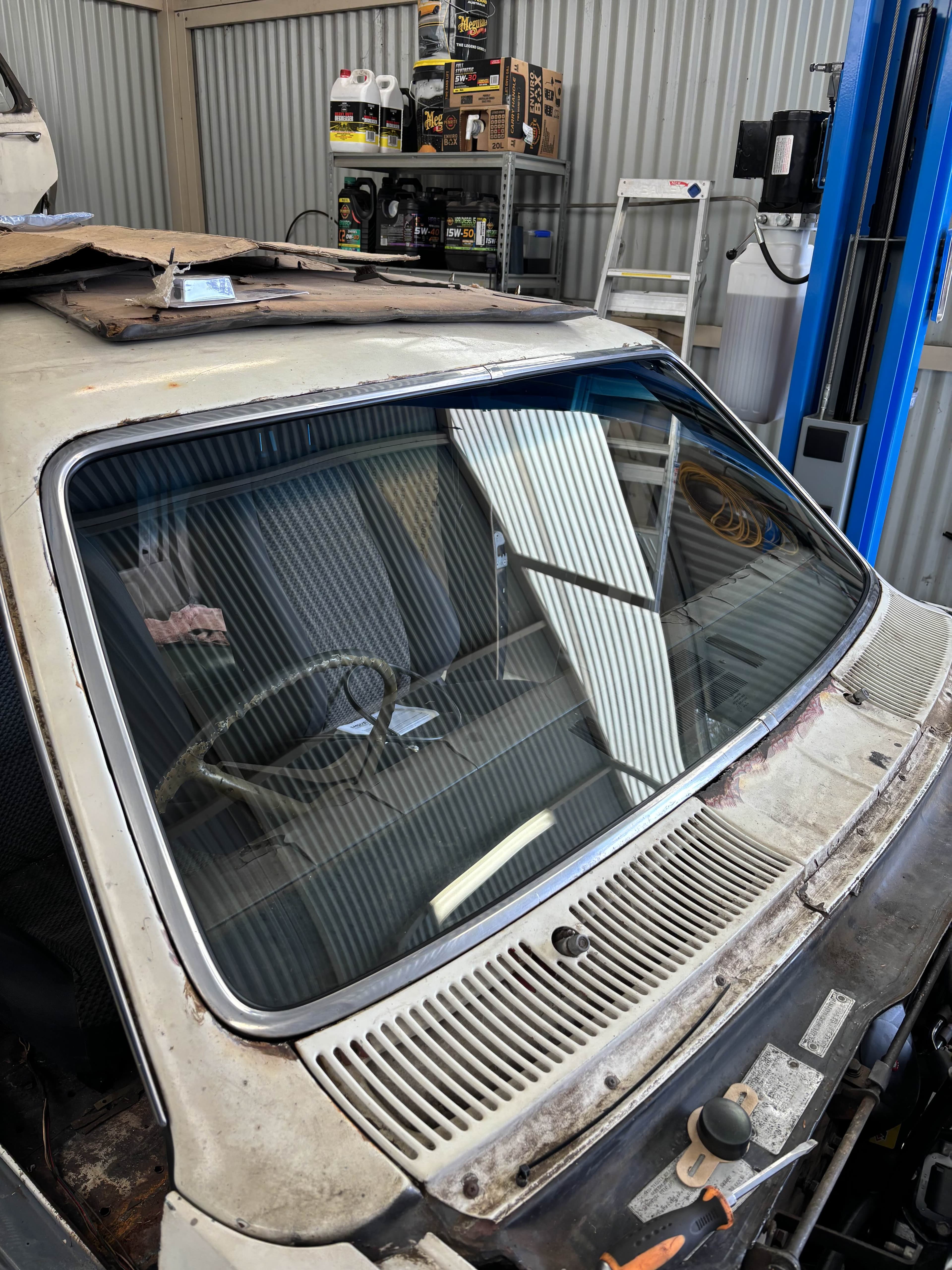 Close-up of a classic car windscreen being fitted